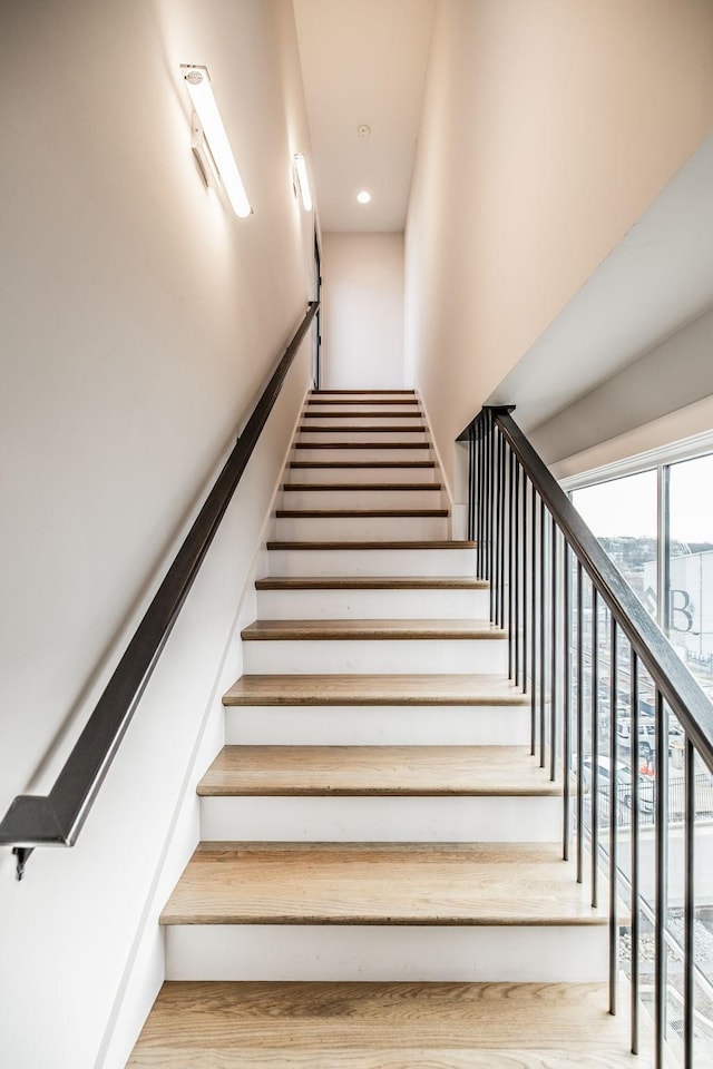 stairs featuring recessed lighting