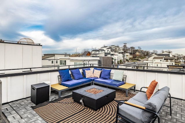 view of patio featuring a residential view and an outdoor living space with a fire pit