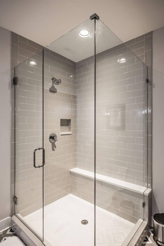 bathroom with a shower stall