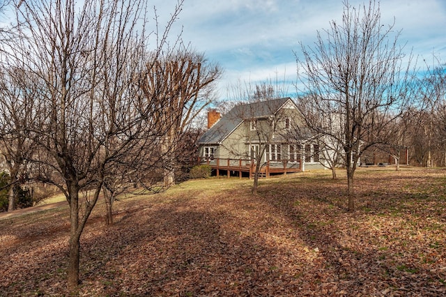 view of yard featuring a wooden deck