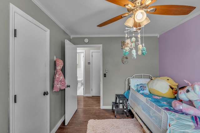 bedroom with ceiling fan, ornamental molding, dark wood-type flooring, and baseboards