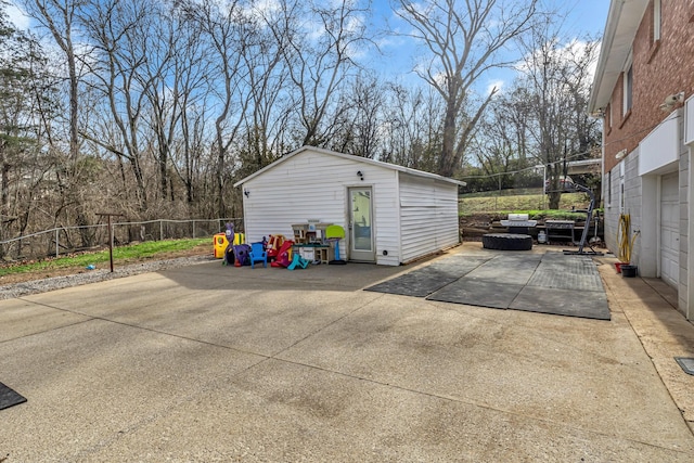 exterior space with an outbuilding and fence