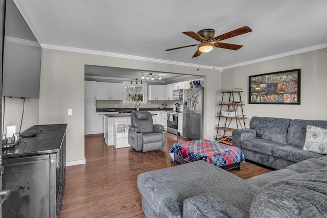 living area with ceiling fan, ornamental molding, dark wood finished floors, and baseboards