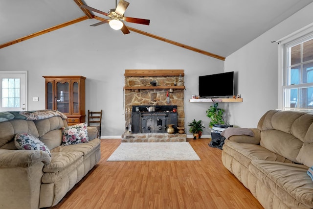 living area featuring light wood-type flooring, high vaulted ceiling, baseboards, and a ceiling fan