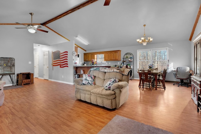 living room featuring vaulted ceiling with beams, light wood-style flooring, baseboards, and ceiling fan with notable chandelier