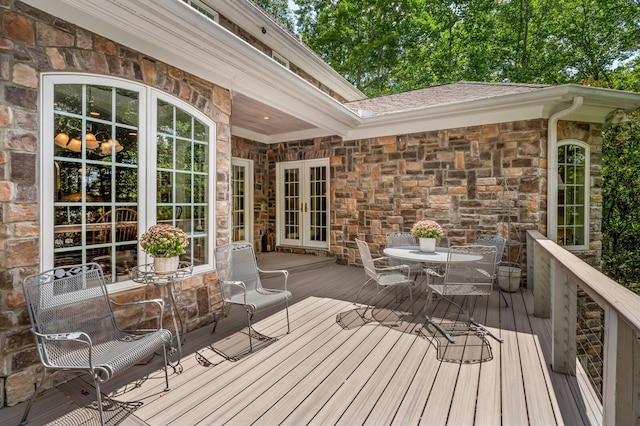 deck featuring french doors and outdoor dining area