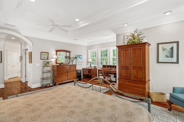 bedroom featuring arched walkways, recessed lighting, baseboards, ornamental molding, and dark wood-style floors