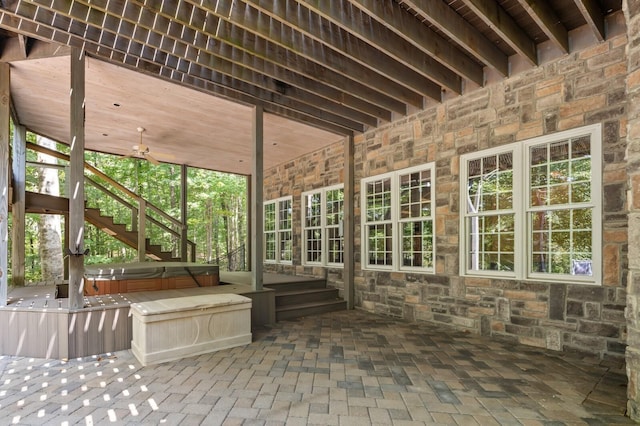 view of patio featuring a covered hot tub