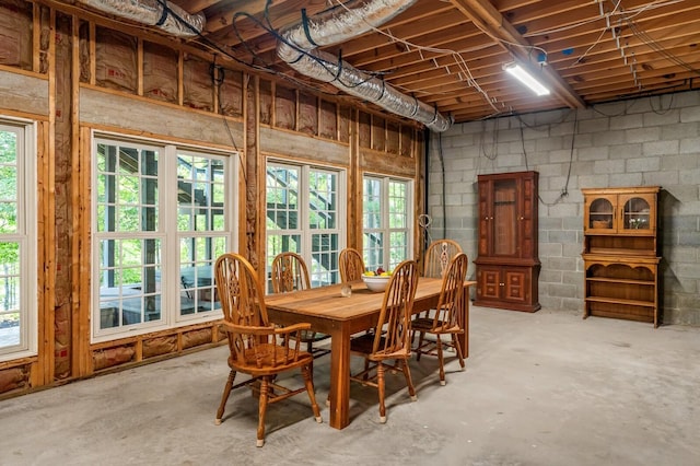 dining area with unfinished concrete floors