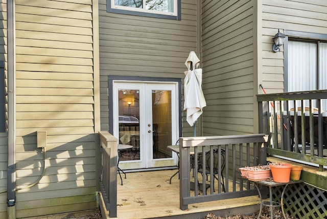 property entrance featuring french doors and a wooden deck