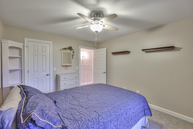 carpeted bedroom featuring a ceiling fan and baseboards