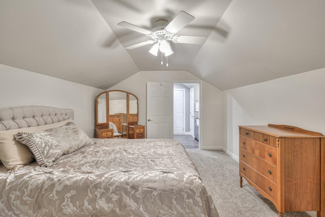 bedroom featuring lofted ceiling, ceiling fan, light carpet, and baseboards