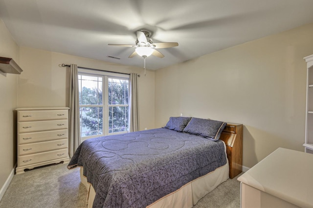 bedroom with light colored carpet, visible vents, ceiling fan, and baseboards