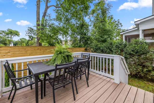 wooden deck featuring outdoor dining space