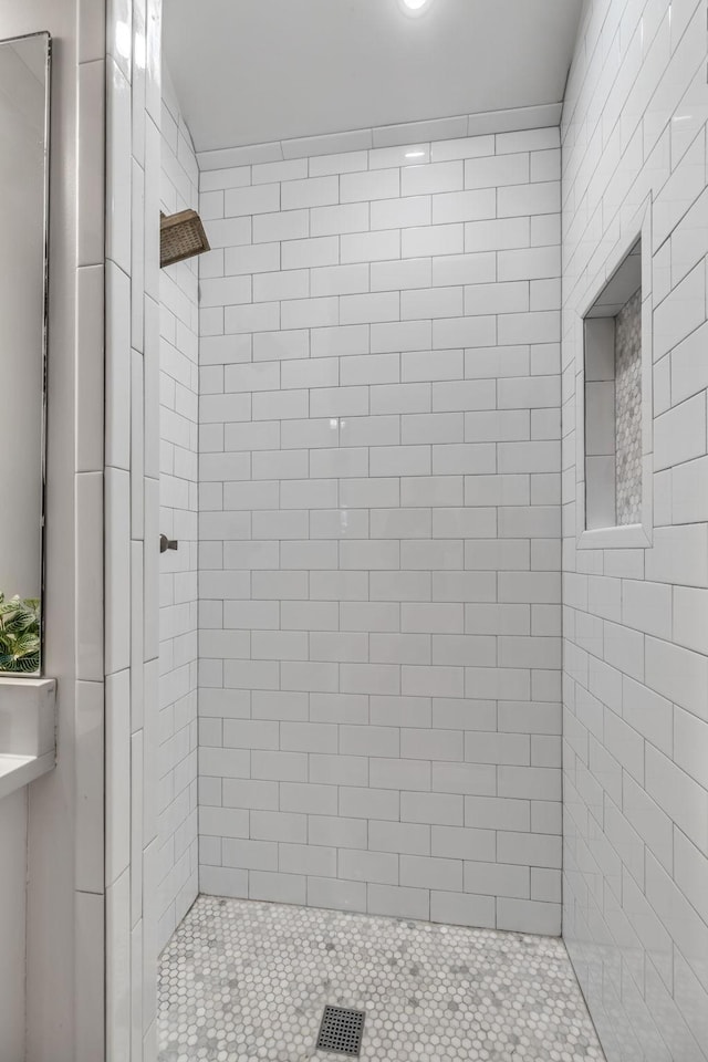 full bathroom featuring a stall shower and visible vents