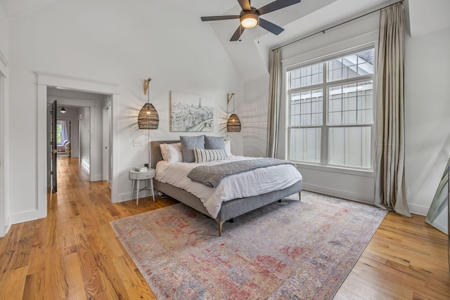 bedroom featuring ceiling fan, wood finished floors, and baseboards