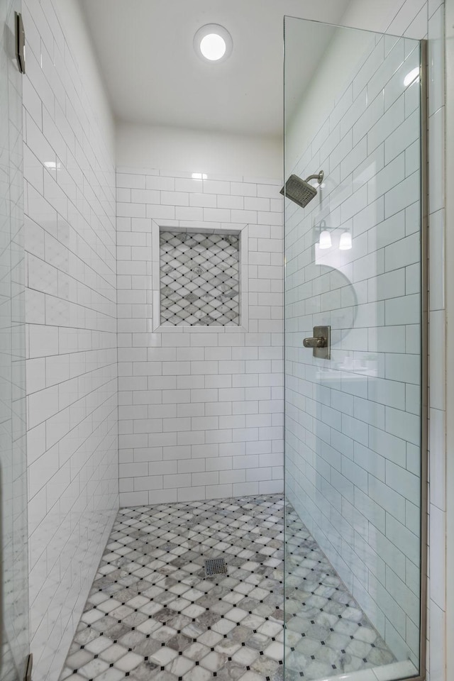 bathroom featuring a shower stall