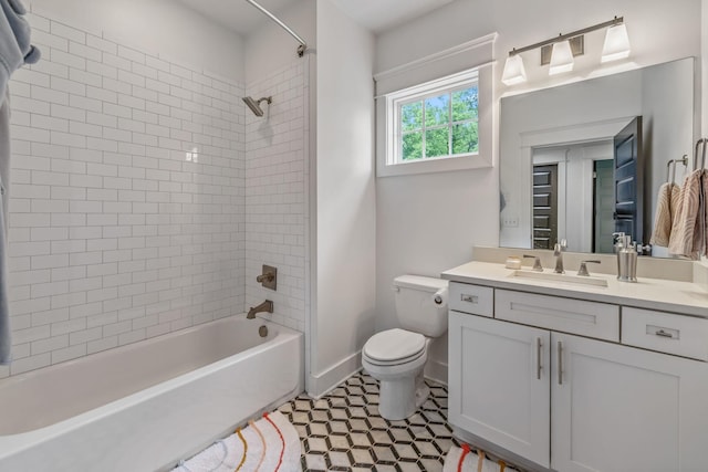 full bath featuring shower / bathtub combination, toilet, vanity, and baseboards