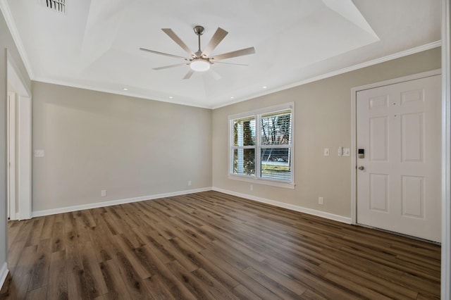 interior space with baseboards, visible vents, ceiling fan, dark wood-type flooring, and crown molding