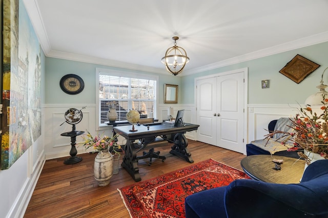 office area with a wainscoted wall, hardwood / wood-style floors, a notable chandelier, and crown molding