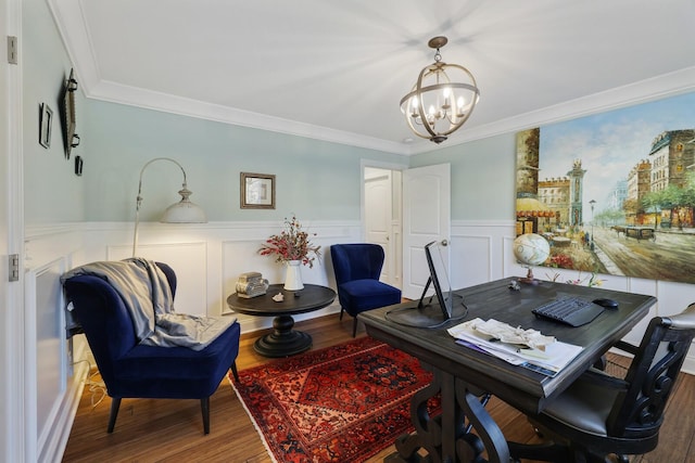 office area with a notable chandelier, ornamental molding, wood finished floors, and wainscoting