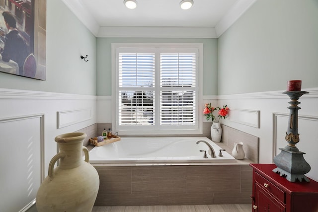 full bathroom with a garden tub and crown molding