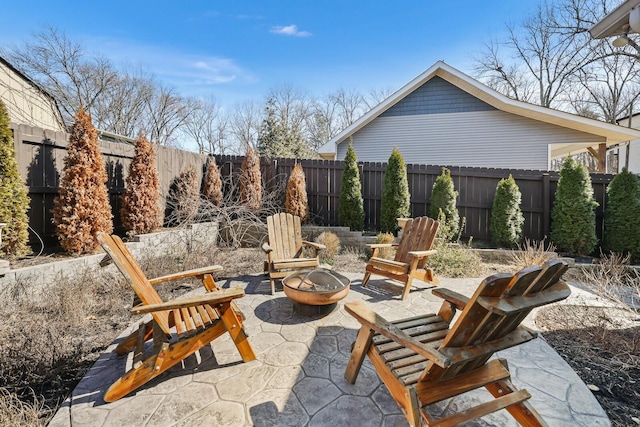 view of patio / terrace with an outdoor fire pit and a fenced backyard