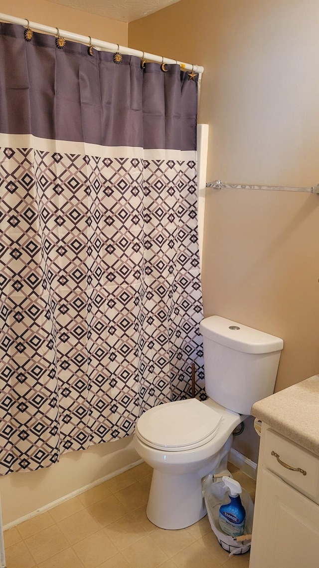 bathroom with shower / bath combo and toilet