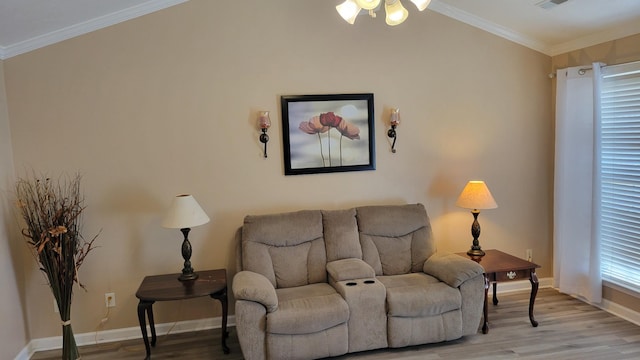 living room with light wood-type flooring, crown molding, and baseboards