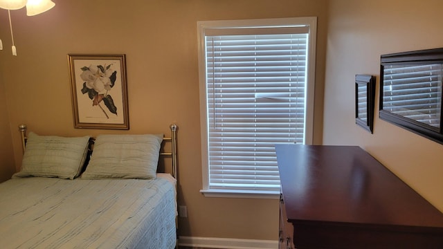 bedroom featuring baseboards