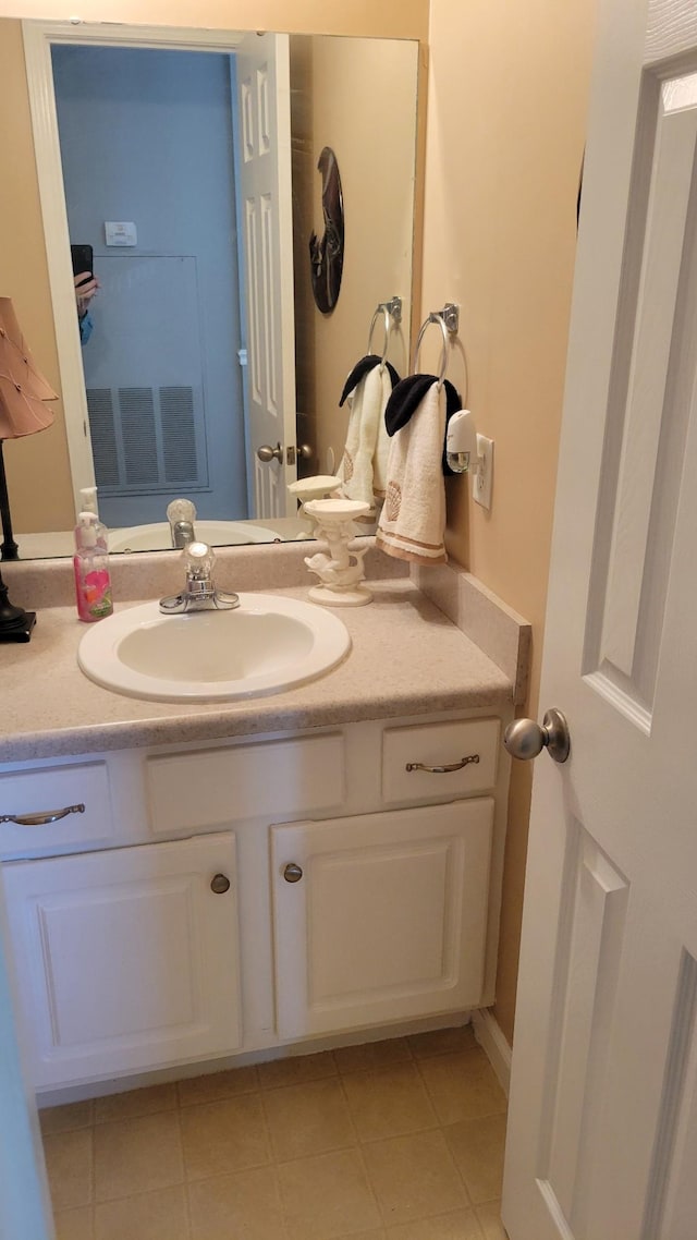 bathroom with vanity and tile patterned floors