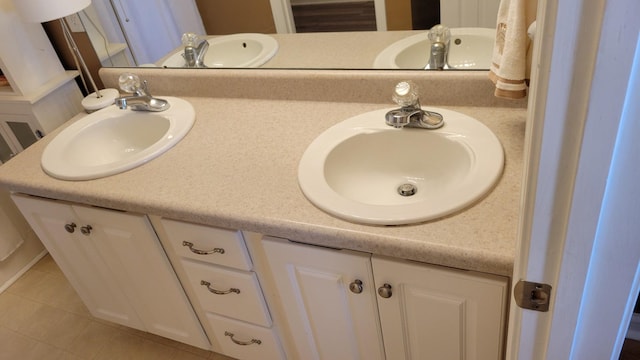 full bathroom featuring double vanity and a sink