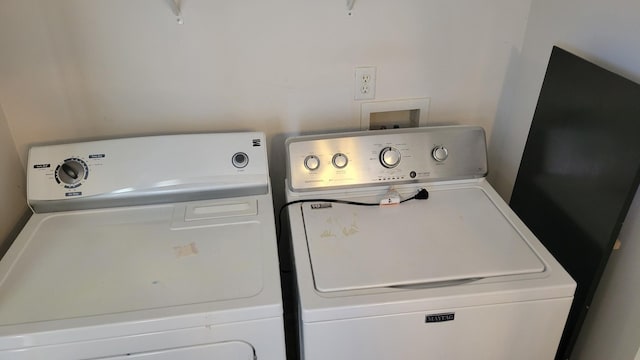 washroom with laundry area and separate washer and dryer