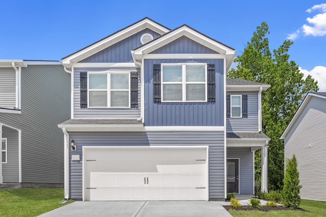 view of front facade with board and batten siding, concrete driveway, a shingled roof, and a garage