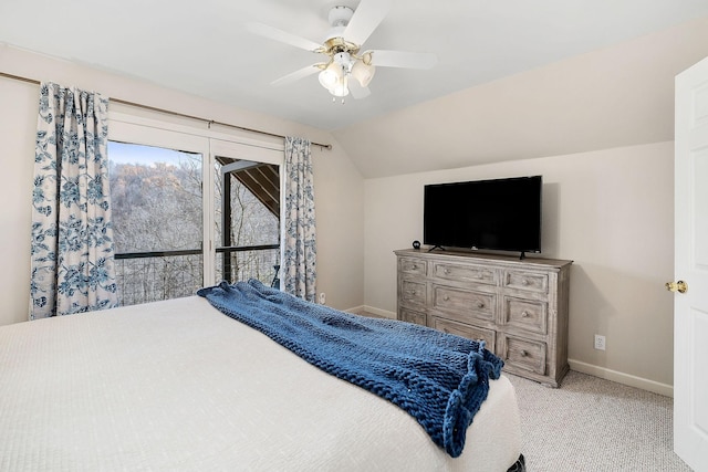 bedroom with lofted ceiling, ceiling fan, baseboards, and light colored carpet