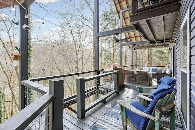 wooden deck with outdoor lounge area