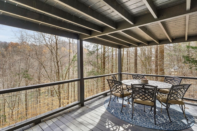 deck featuring outdoor dining area