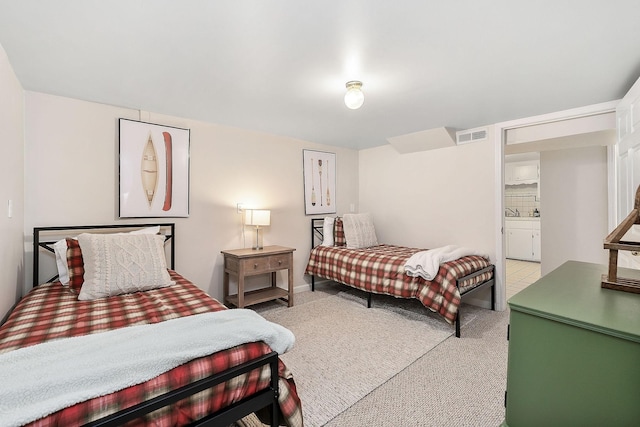 bedroom with light carpet and visible vents