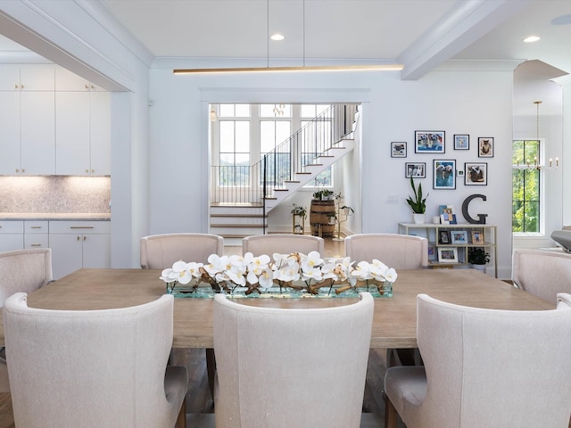 dining space with stairway, plenty of natural light, beam ceiling, and recessed lighting