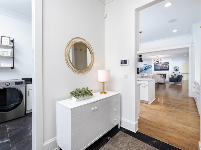 interior space featuring dark wood-style flooring, recessed lighting, washer / dryer, and crown molding