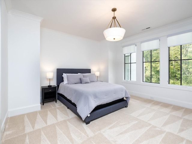 bedroom with light carpet, baseboards, visible vents, and crown molding