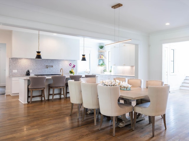 dining room featuring stairway, ornamental molding, dark wood finished floors, and recessed lighting