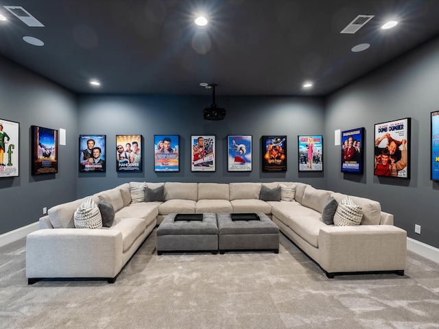 home theater with recessed lighting, light colored carpet, and visible vents