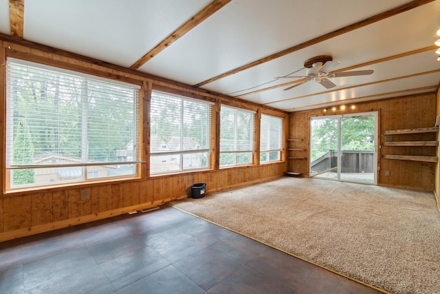 interior space with ceiling fan and beam ceiling