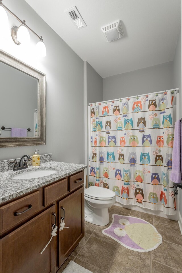 full bath with toilet, tile patterned flooring, vanity, and visible vents