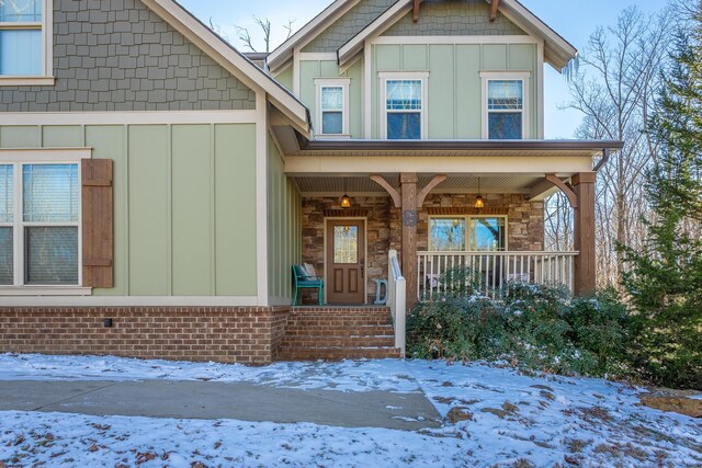 view of front of house featuring covered porch and board and batten siding