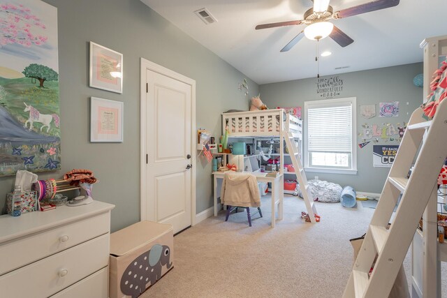 bedroom featuring ceiling fan, visible vents, baseboards, and light colored carpet