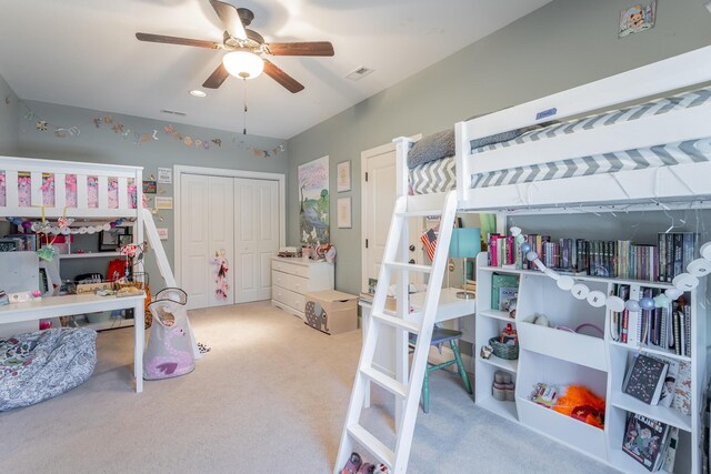 bedroom featuring light carpet, visible vents, and a ceiling fan