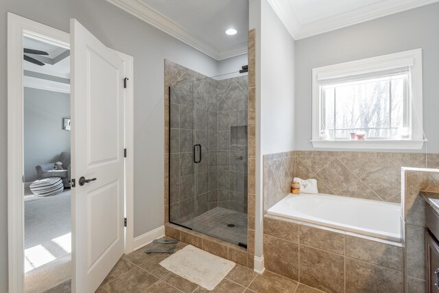 bathroom with tile patterned flooring, vanity, a bath, a stall shower, and crown molding