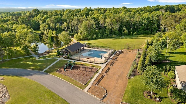 drone / aerial view featuring a view of trees